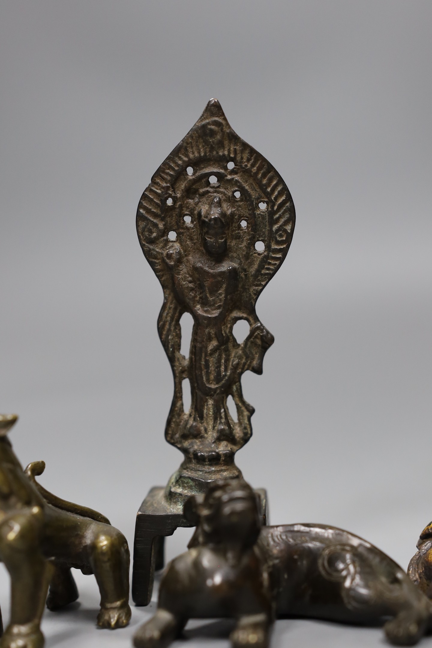 Five Chinese or Tibetan bronze figures or Buddhist implements, tallest 13cms high